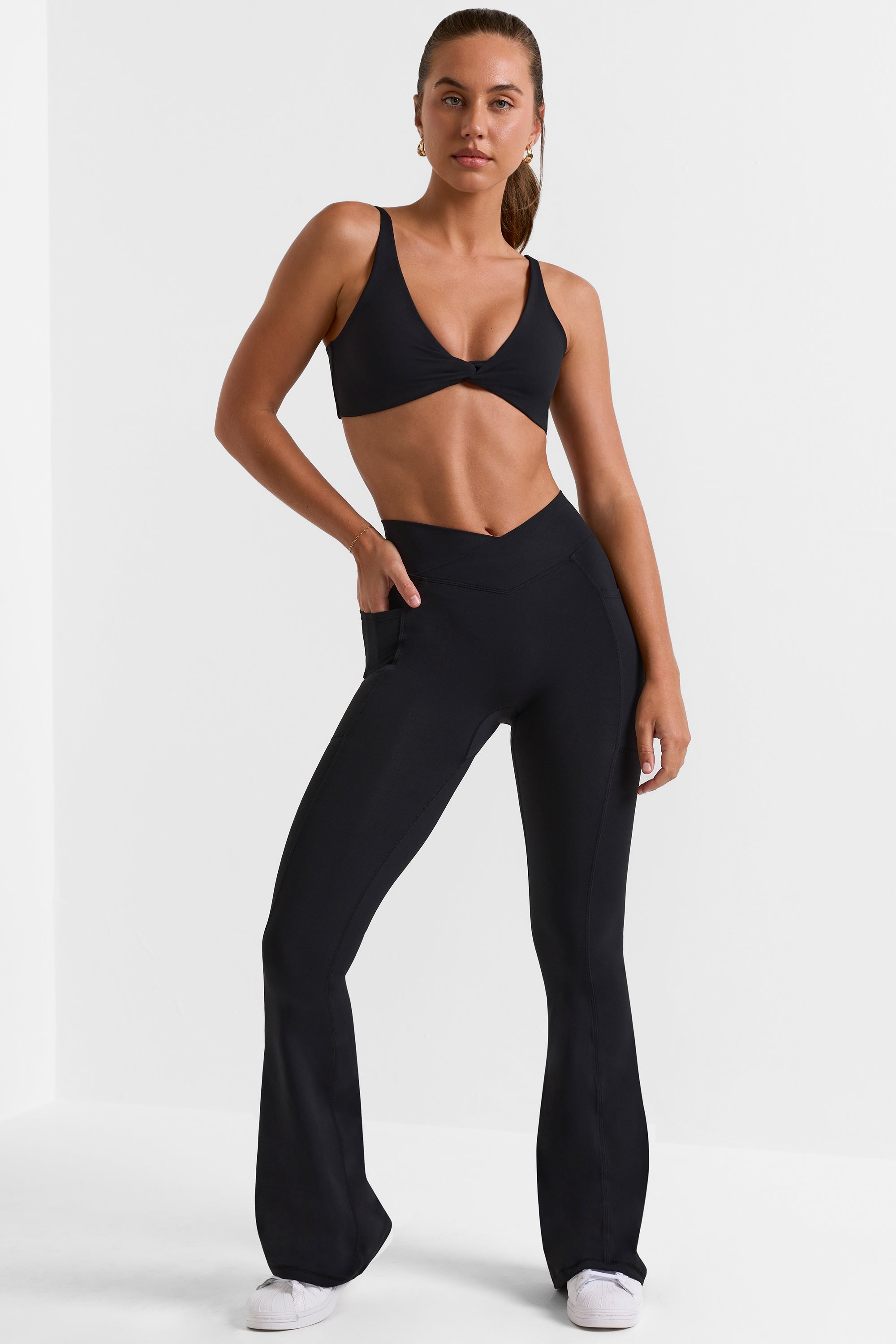 Petite Cross Waistband Flare Pocket Leggings in Black