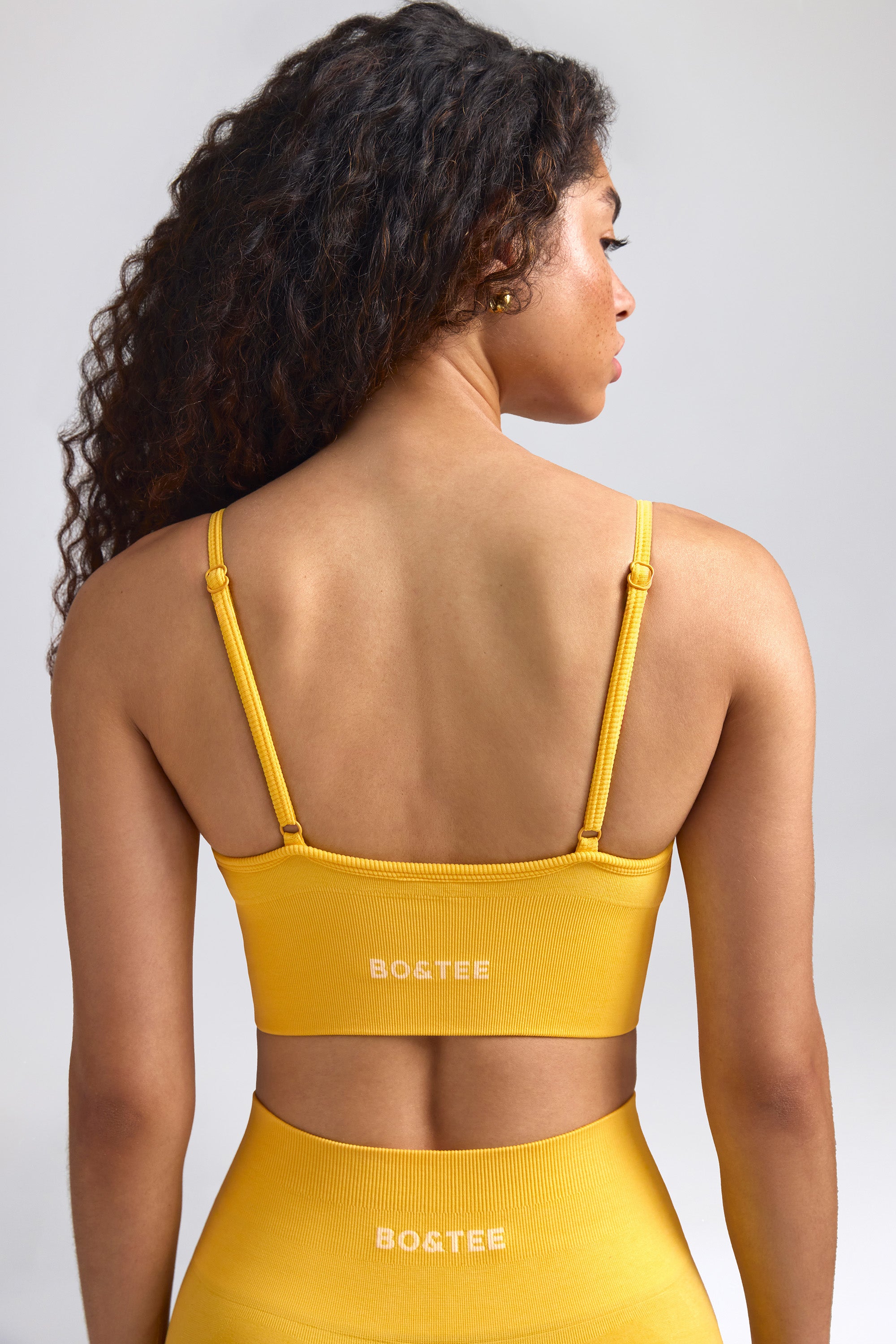 Define Luxe V-Neck Sports Bra in Golden Yellow