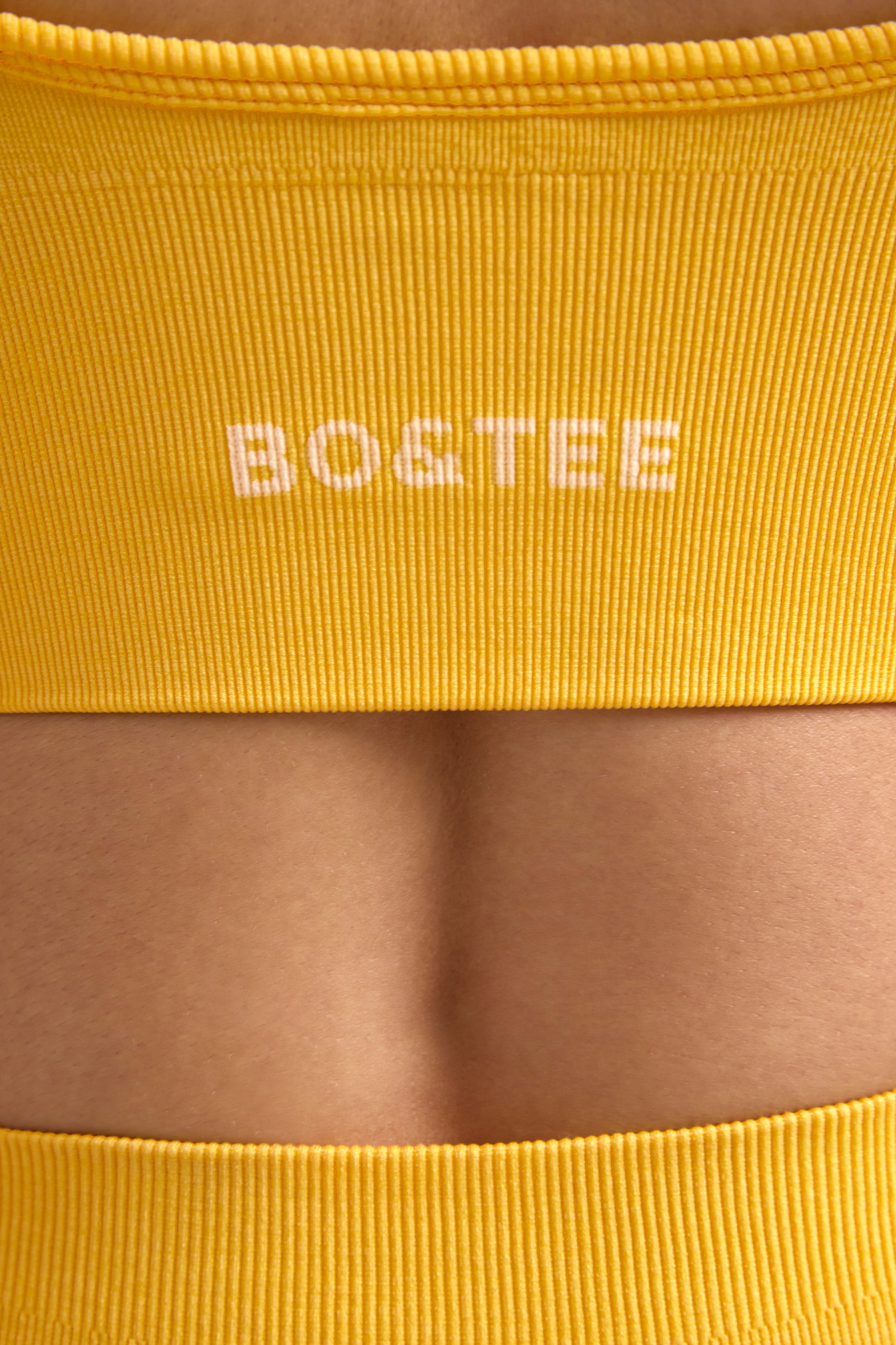 Define Luxe V-Neck Sports Bra in Golden Yellow