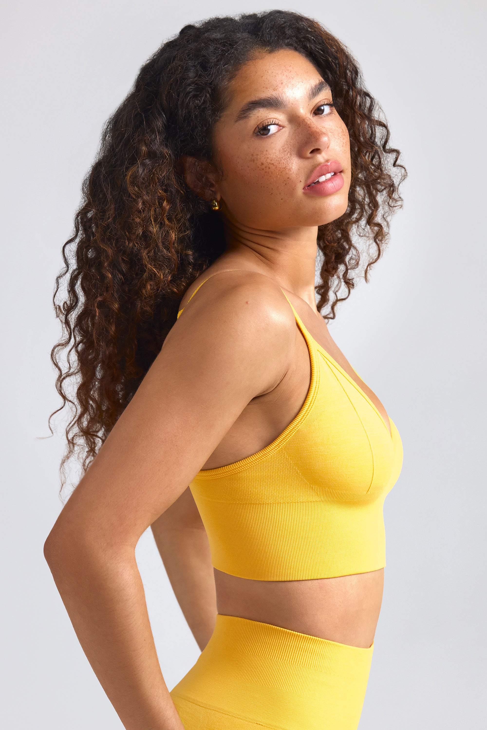 Define Luxe V-Neck Sports Bra in Golden Yellow