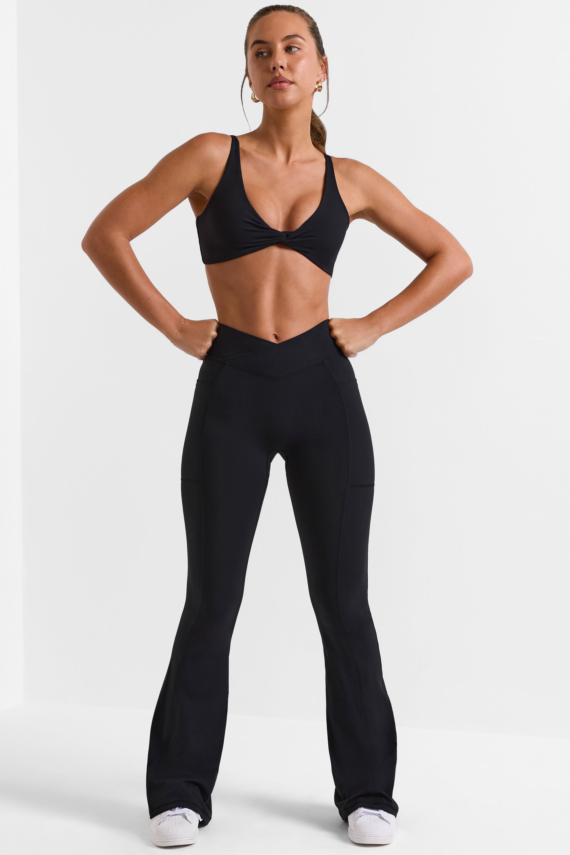 Petite Cross Waistband Flare Pocket Leggings in Black