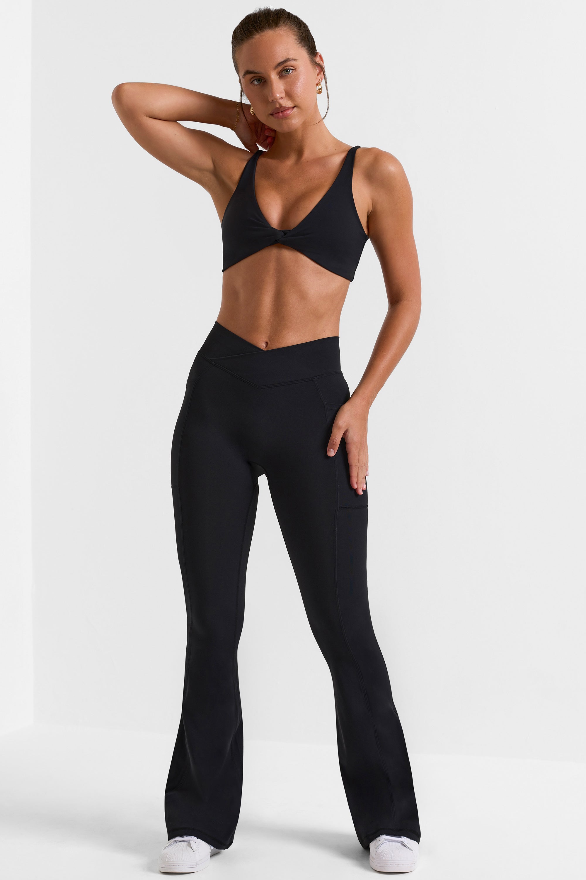 Petite Cross Waistband Flare Pocket Leggings in Black