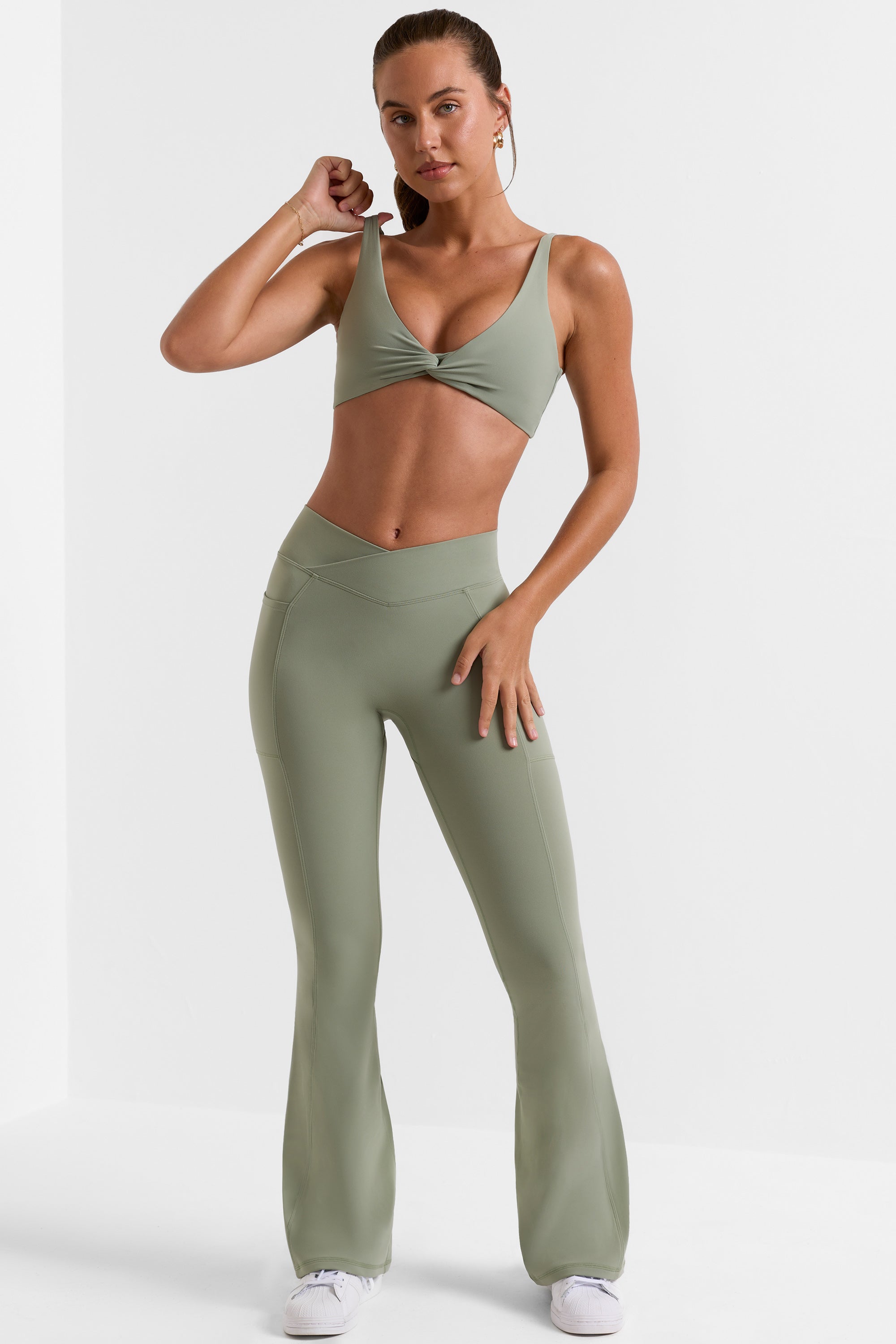 Cross Waistband Flare Pocket Leggings in Bamboo Green