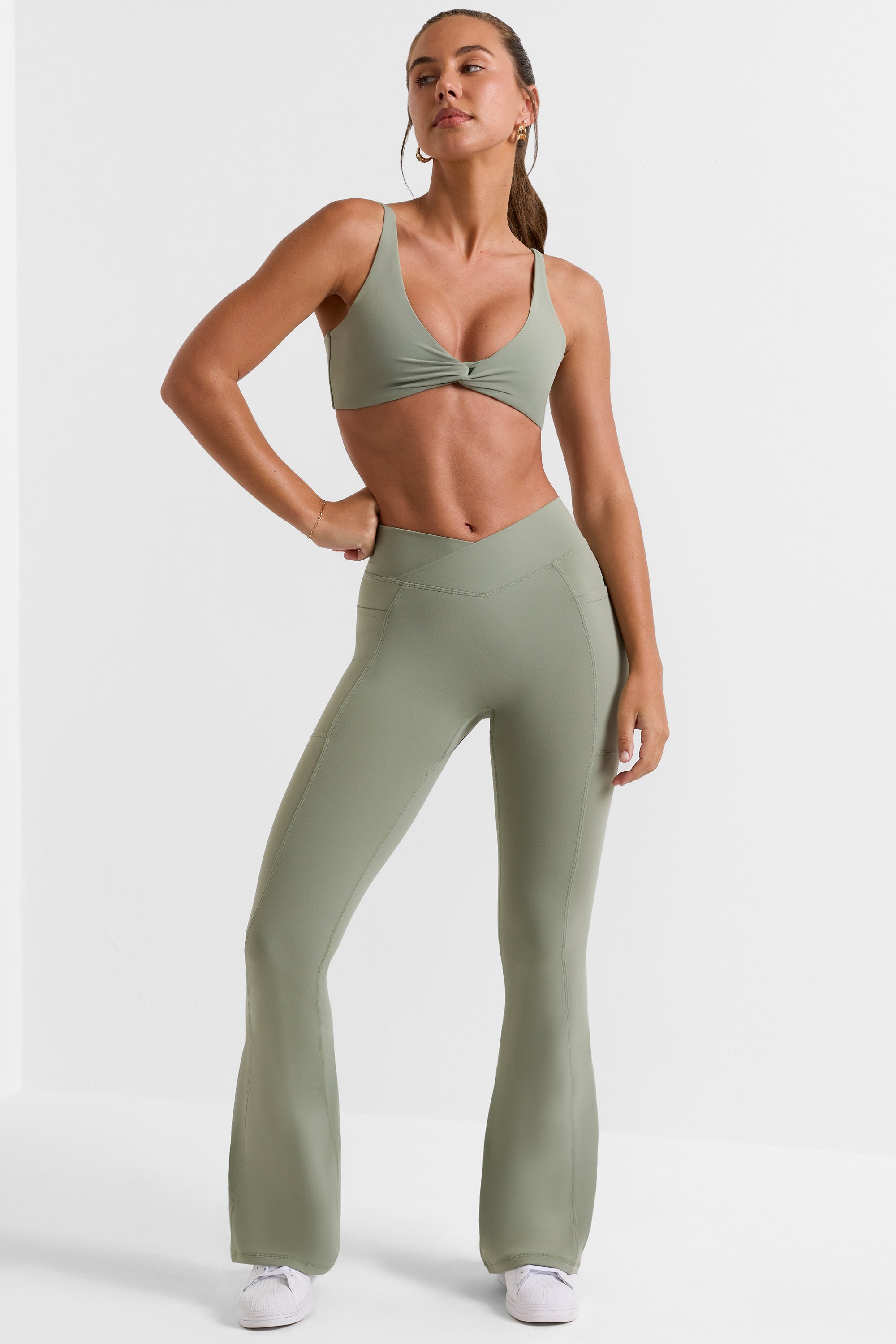 Cross Waistband Flare Pocket Leggings in Bamboo Green