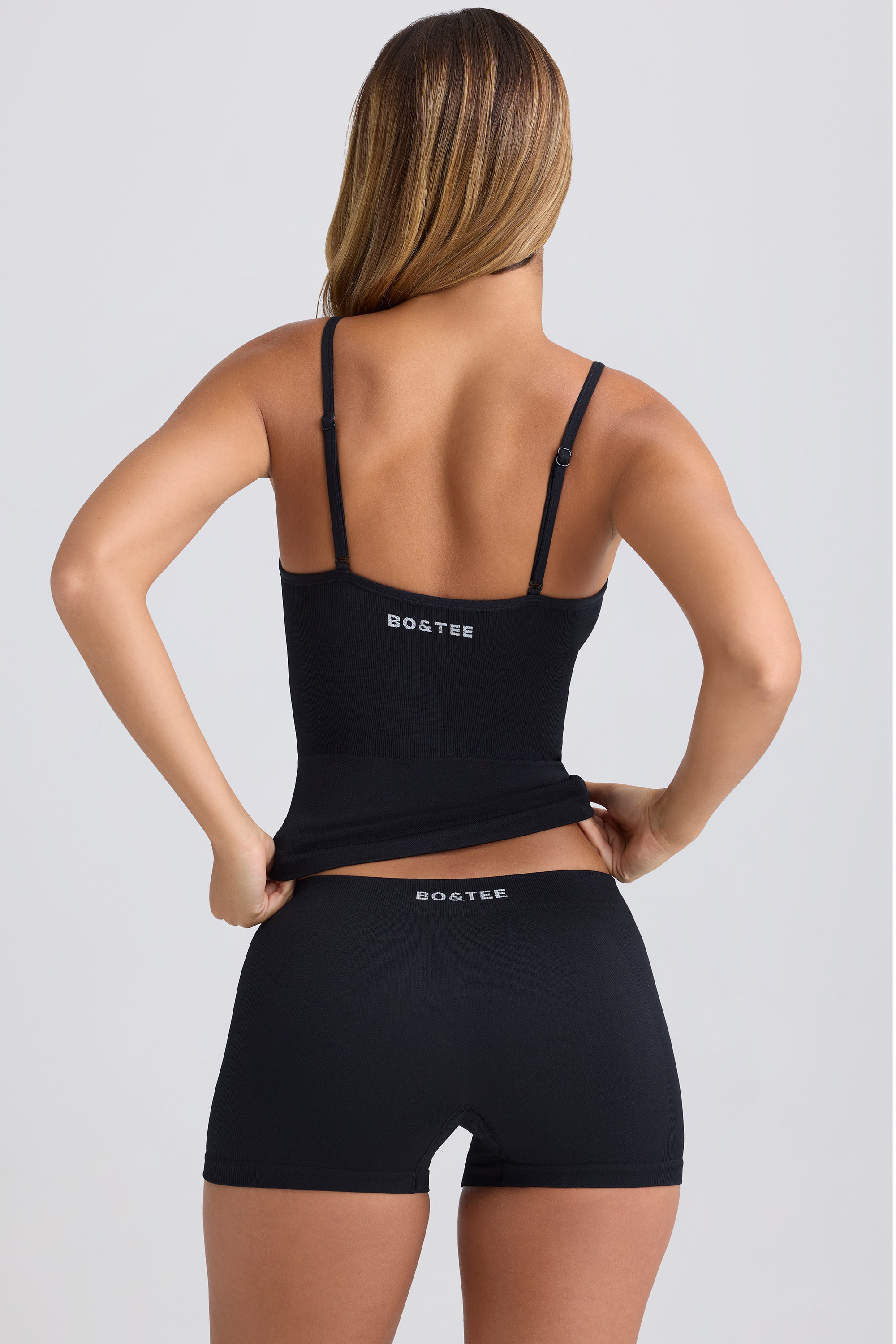 Super Sculpt Seamless Mid-Rise Mini Shorts in Black