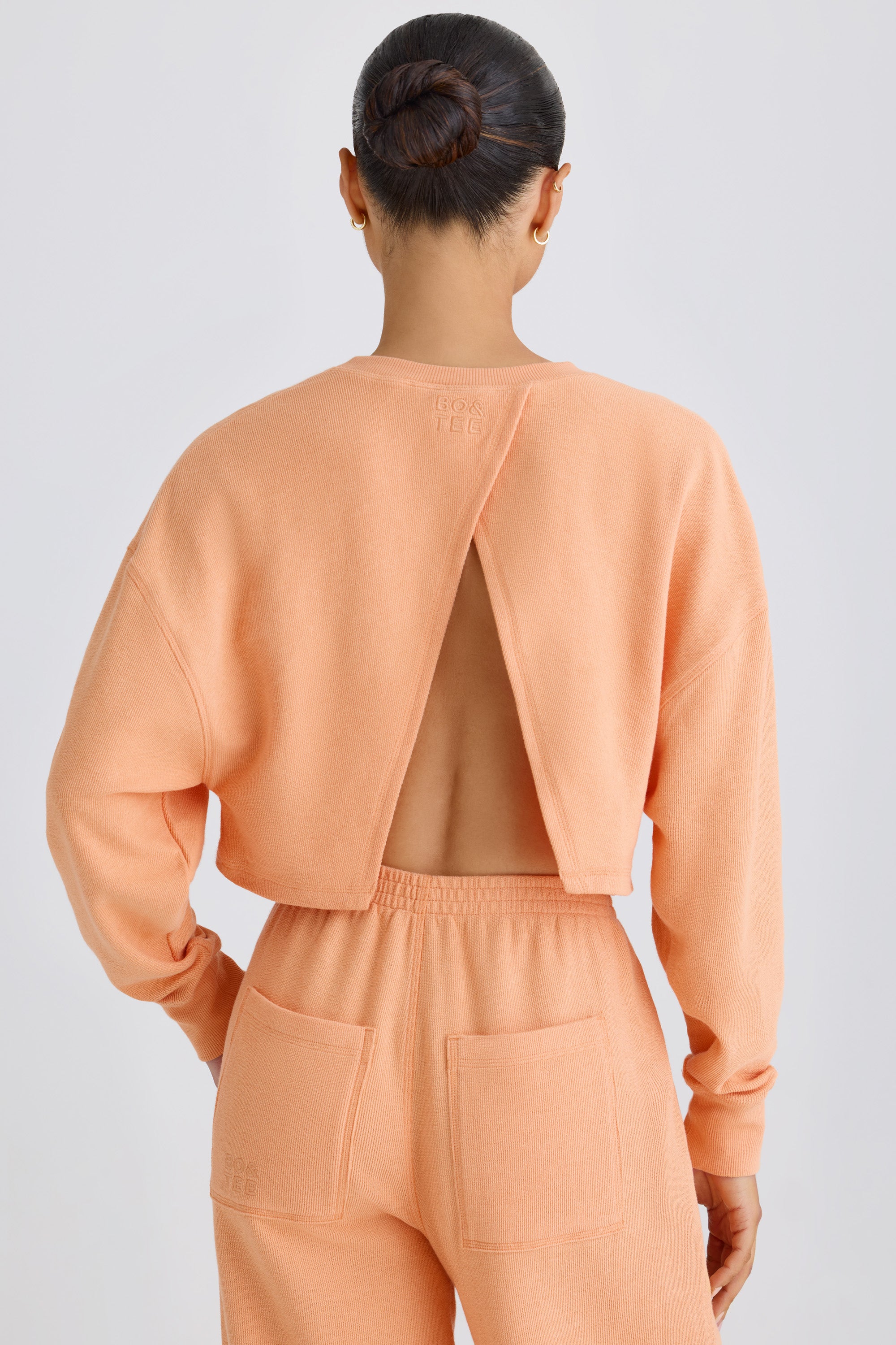 Crew-Neck Open-Back Cropped Sweatshirt in Peach