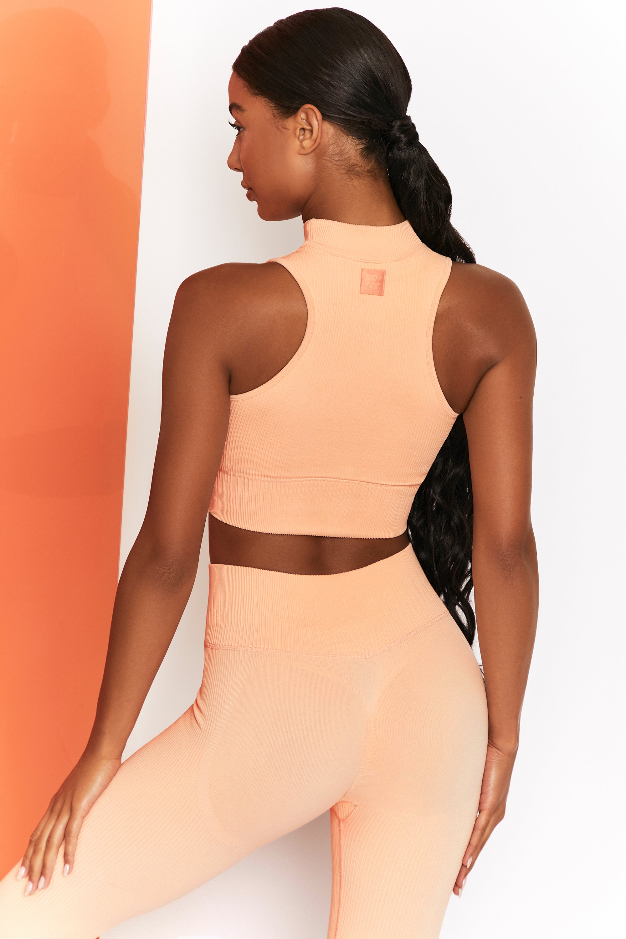 Miles Ahead Ribbed High Neck Crop Top in Peach